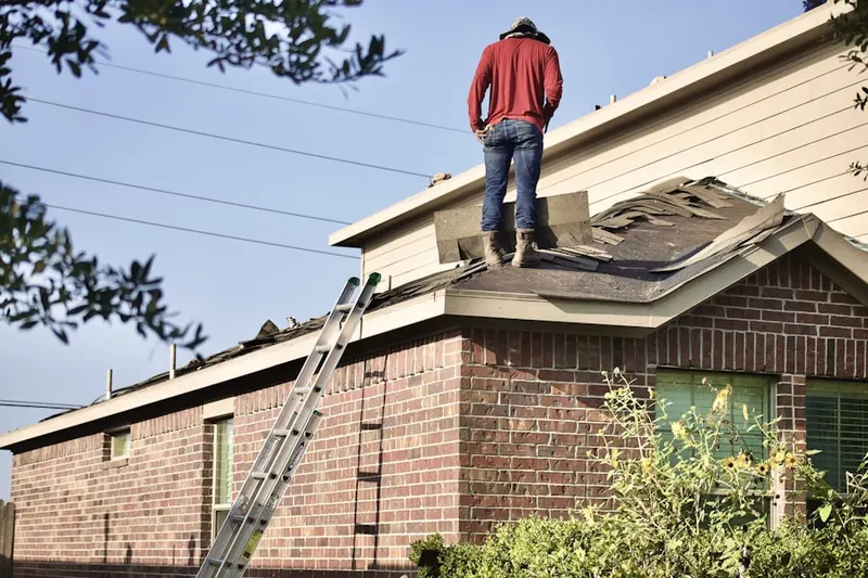 Professional roofer working on a residential roof in Beltsville